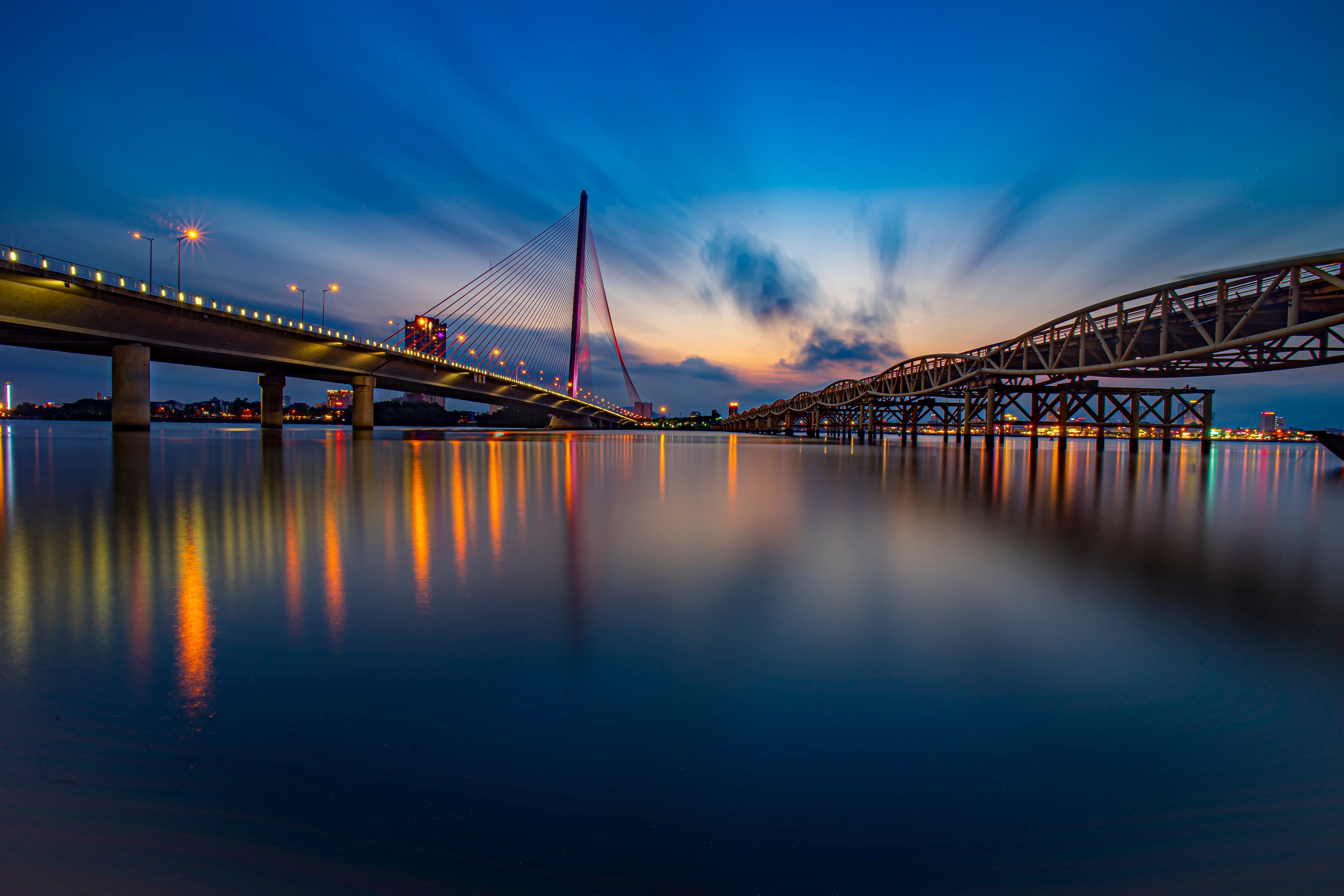 Illuminated bridge at night